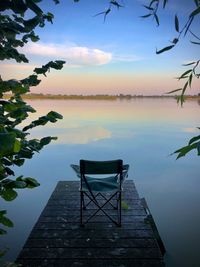 Scenic view of lake against sky during sunset