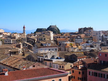 View of cityscape against blue sky