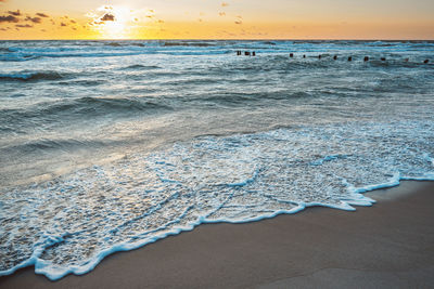 Scenic view of sea against sky during sunset