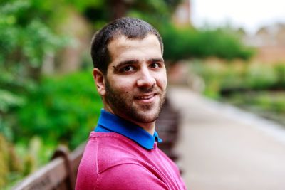 Portrait of young man standing outdoors