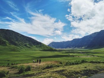 Scenic view of landscape and mountains against sky