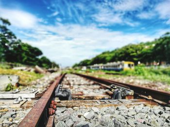 Train on railroad track against sky