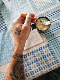 Close-up of hand holding drink