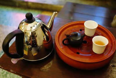 High angle view of tea served on wooden table