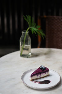 Close-up of cake served on table