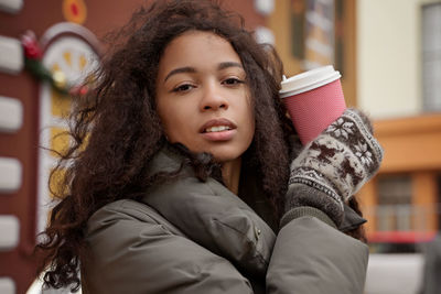 Portrait of smiling young woman looking away