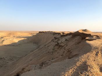 Scenic view of desert against clear sky