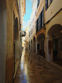 Narrow street amidst buildings in town