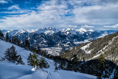 Scenic view of snowcapped mountains against sky