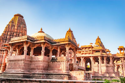 Ancient hindu temple architecture with bright blue sky from unique angle at day