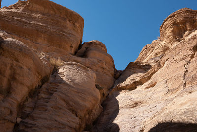 Low angle view of rock formation against clear sky