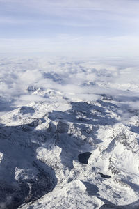 Aerial view of landscape against sky during winter