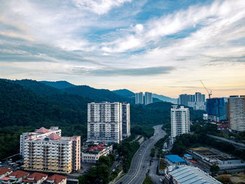 High angle view of buildings in city against sky