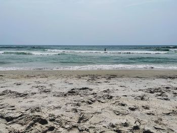 Scenic view of beach against clear sky