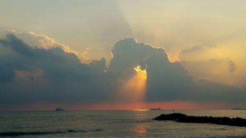 Scenic view of sea against dramatic sky