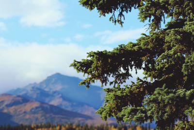 Scenic view of mountains against cloudy sky