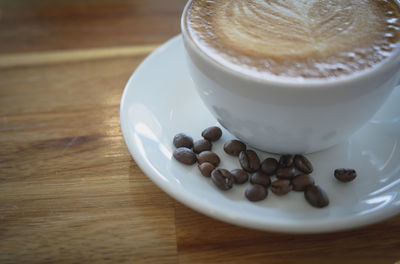 High angle view of coffee in cup on table