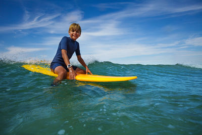 Man kayaking in sea