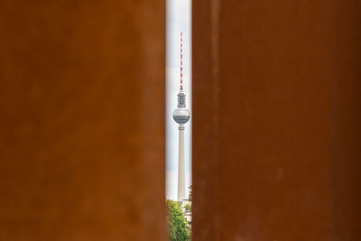 Fernsehturm seen from brown wall