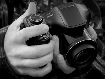 Cropped image of woman photographing through smart phone