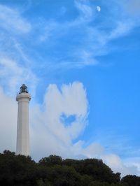 Low angle view of lighthouse against blue sky