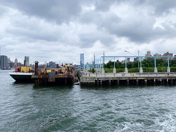 Pier over river against sky