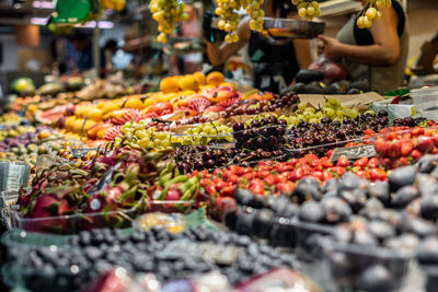 Side view with selective focus to fresh fruit in the greengrocer's market