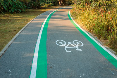 High angle view of arrow symbol on road in city