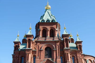 Low angle view of buildings against blue sky