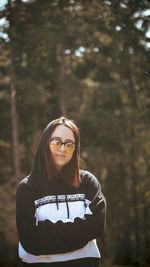 Portrait of young woman in forest