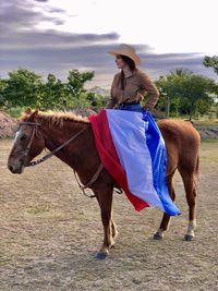 Horse standing on field