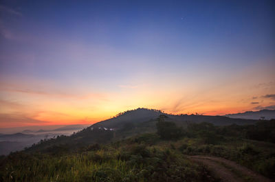 Scenic view of landscape against sky during sunset