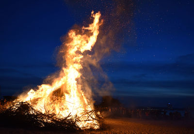 Bonfire at beach during night