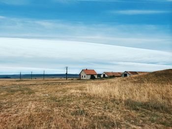 House on field against sky