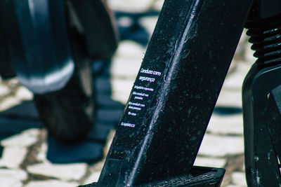 Close-up of text on metal railing