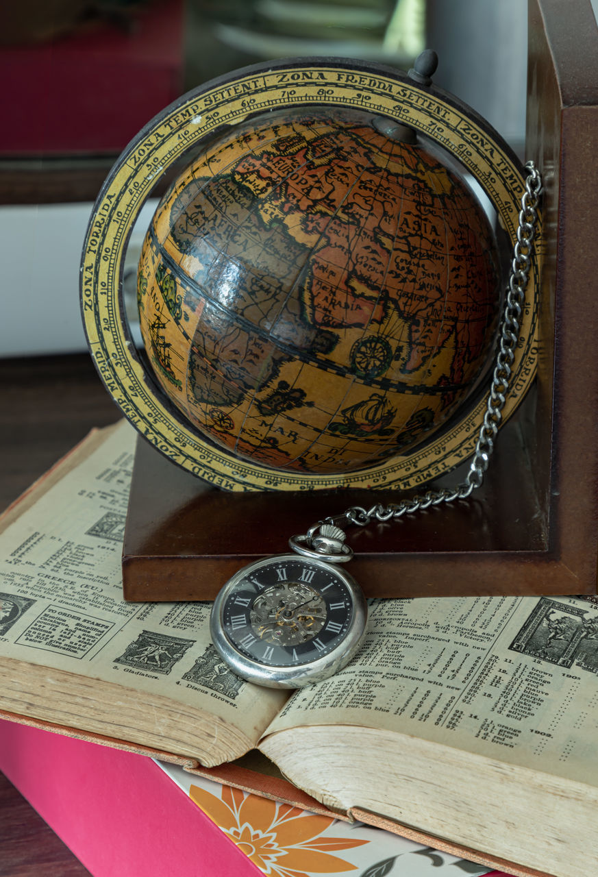 finance, map, no people, art, indoors, globe - man made object, globe, currency, business, table, money, paper, close-up, still life
