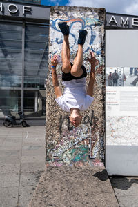 Rear view of woman jumping on the floor