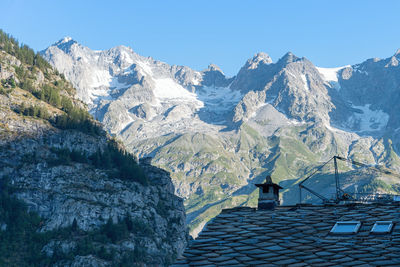 Scenic view of snowcapped mountains against clear sky