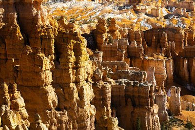 Close up telephoto zoom photo of bryce canyon national park hoodoos lit by sun.