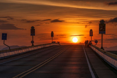 Scenic view of road against sky during sunset