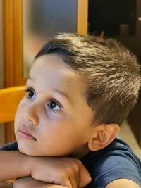 Close-up portrait of boy looking away