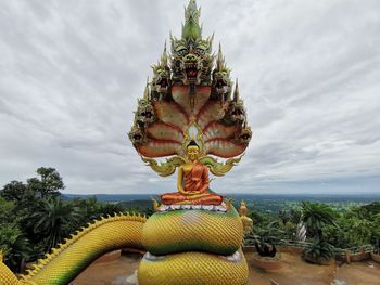 Statue of buddha against sky