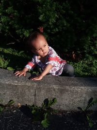 Cute girl playing with plants