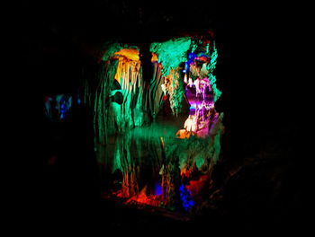 Close-up of illuminated lighting equipment in cave