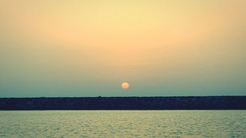 Scenic view of sea at sunset