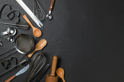 High angle view of coins on table against black background