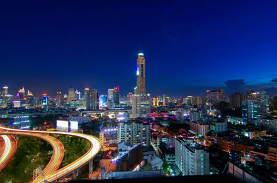 Illuminated buildings in city at night