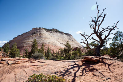 Scenic view of rocky mountains against clear blue sky