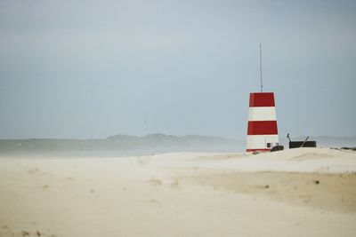 Lifeguard hut on beach against clear sky