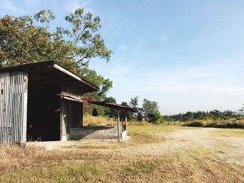 Abandoned built structure on landscape against sky